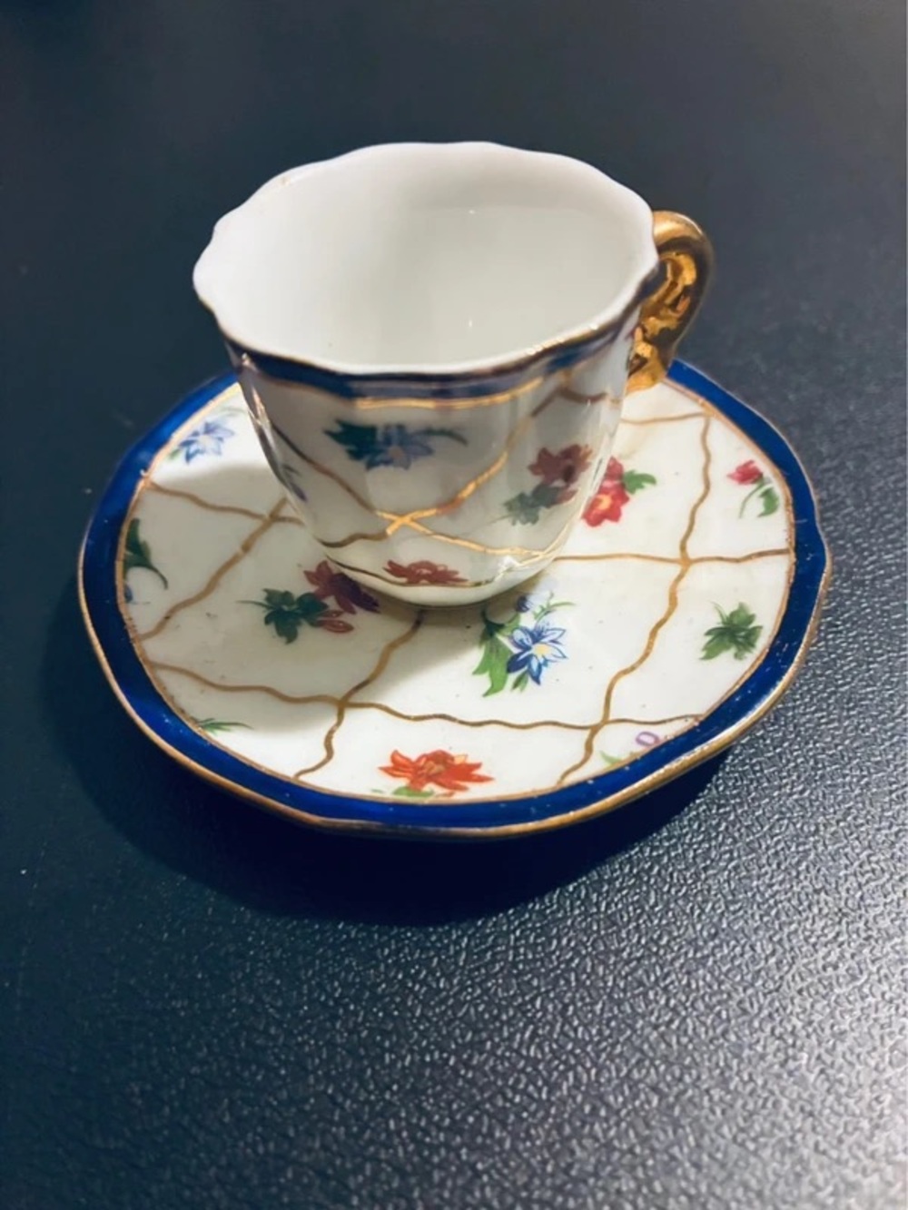 Porcelain Demitasse Cup and Saucer with Gold Trim in White and Blue